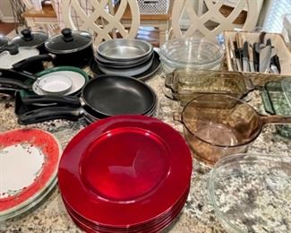 Red chargers, more pots and pans, kitchen utensils