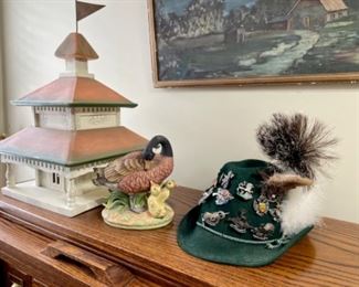 duck figurine, felt hat with pins
