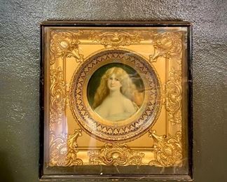 Antique plate mounted on an antique frame