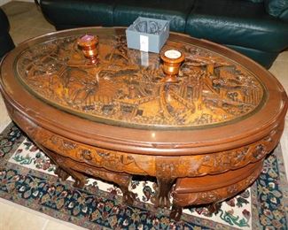 Heavily carved Asian Tea table with 6 stools.