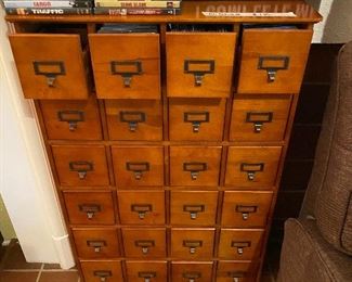 CD cabinet - full of CD’s! VCR tapes and small saying