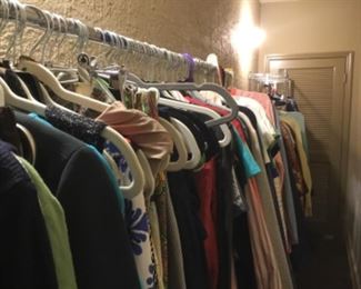 Storage area - 4 racks of clothing