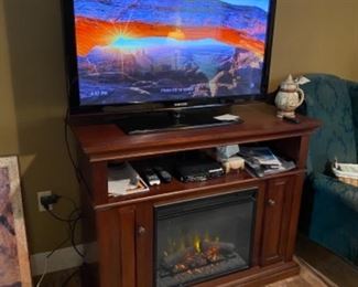 You dont have to worry about those cold days and nights anymore! This electric fireplace will chase away the chill in a New York minute! Oh and check out the picture on this TV!!!