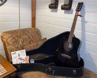 Vintage Hohner acoustic guitar. Comes with case, capo, tuner and books.
