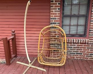 Vintage wicker egg with metal stand. We’ll have it hanging for you on sale day. Wicker does have a couple spindles missing. Still functioning with a cushion. 