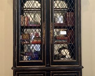 Pair of outstanding painted black and gold lighted bookcases with mirrored back