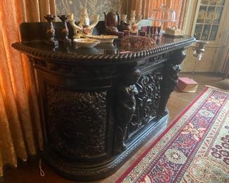HEAVILY CARVED ENGLISH DEMILUNE CONSOLE WITH FIGURAL SURMOUTHS
