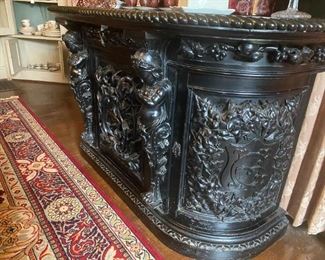 HEAVILY CARVED ENGLISH DEMILUNE CONSOLE WITH FIGURAL SURMOUNTS