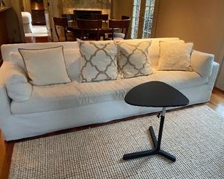 Another beautiful Restoration Hardware sofa  108" w x 36"d x 31"h. $3800.  Spare slipcover cover included.              Ikea lap top table like white one in prior photos  $38