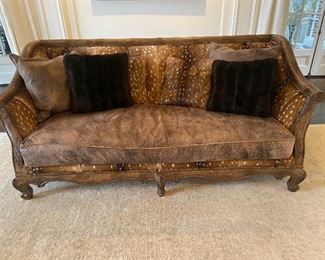 Gorgeous oversized deer skin and leather with a wood frame sofa.  86"w x 39"dx 36"h.  $3000.  Total statement piece, yet comfortable.