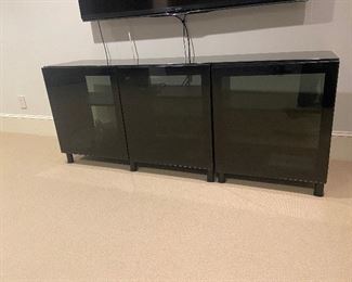 .Three piece media entertainment cabinet 71"l x 16.5"h x 29”h Besta Glasvik from Ikea.  Has glass top to keep the three pieces from separating.  New it retailed for approx.  $500.    Asking $280 for the set