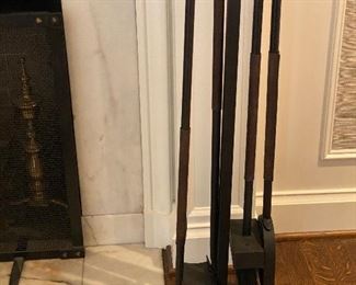 Heavy wrought iron fireplace tools.  Leather sleeves and hanging rack.  Sold in person during the in-person shopping Friday and Saturday. 