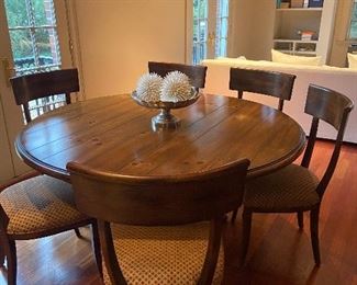 Milling Road for Baker chairs and Ralph Lauren 63" round dining table is 30"h and has one leaf that is 22"w turning the table into an 85"l oval .  Has 6 chairs.  $900 as found 