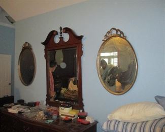 Pair of gilt wood oval mirrors and Chippendale style mirror