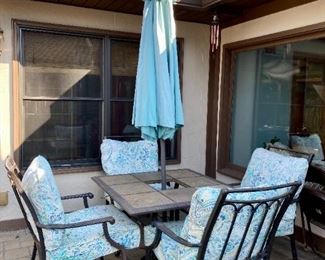 Patio table and chairs. with umbrella