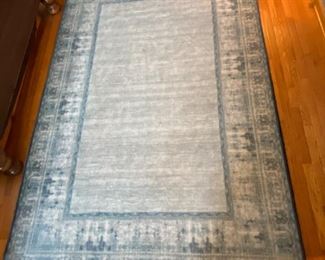 Area rug by Ruggable.     approx 5'x8'