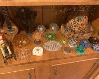 collection of glass and stone ware floral frogs