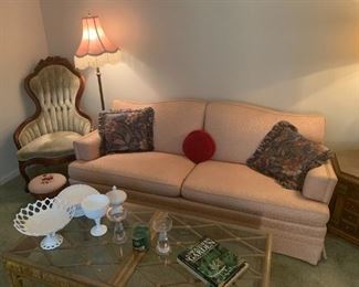 Pink sofa, bamboo and glass coffee table, milk glass pieces