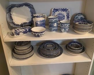 Blue and white willow butter dish, trays, cups, sugar and creamers.