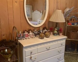 White dresser, white oval mirror