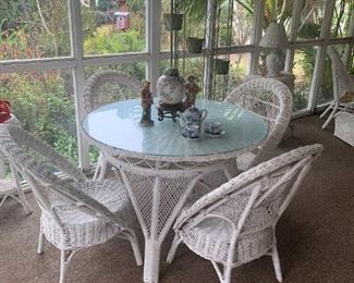 White wicker patio table with 4 chairs