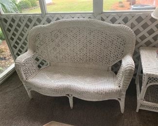 White wicker love seat