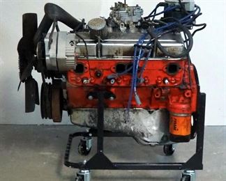 Chevy 350 Engine Including Distributer, Carburetor, Alternator And Fly Wheel On Rolling Stand