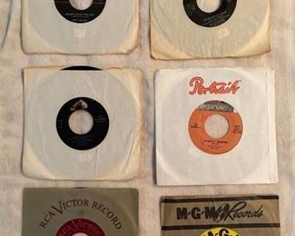 Six 45 rpm records featuring Ricky Nelson, Elvis, and more