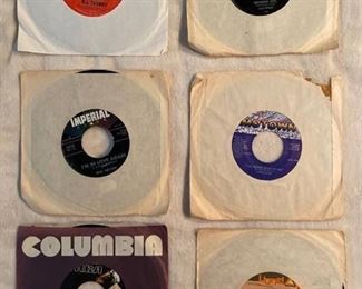 Six 45 rpm records featuring BJ Thomas, Ricky Nelson, Elvis, Charlene, and more