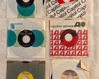 Six 45 rpm records featuring Sandy Posey, Monkees, Herman's Hermits, Irene Cara, and more
