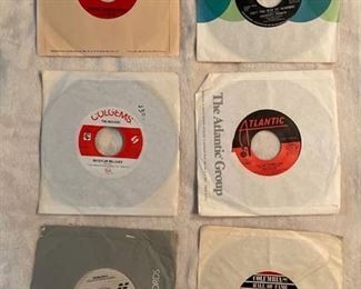 Six 45 rpm records featuring Paul Revere, Herman's Hermits, Monkees, Irene Cara, Phil Collins, and Chicago