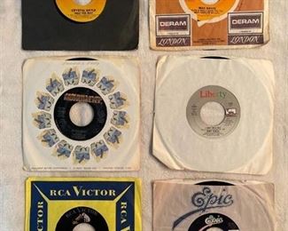 Six 45 rpm records with a country flair featuring Crystal Gayle, Mac Davis, Kenny Rogers, Gaitlans, and more