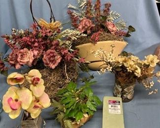 Large assortment of floral decor including wall sconce
