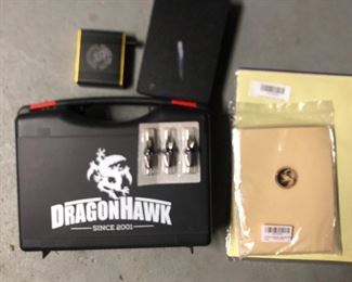 Lightly (once or twice) used tattoo gun with new gun tips, practice sheets, inks, etc. 