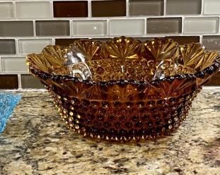 Vintage Amber Hobnail Dish, Daisy And Button Handle Basket, And A Fenton Cranberry Glass Pitcher