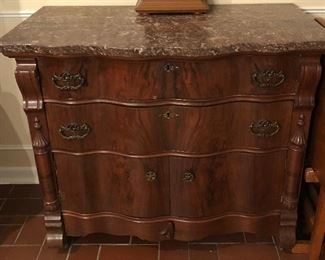 Antique walnut and shaped marble cabinet.  Serpentine drawers over 2 lower cabinets