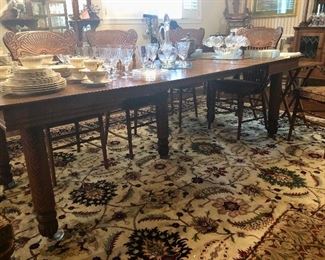 Antique oak farmhouse table extends to comfortably seat 8. 