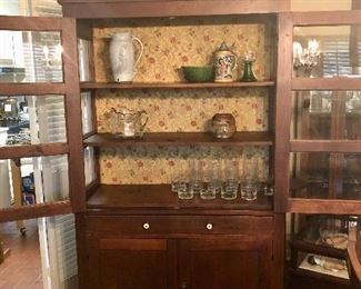 Antique Arts & Crafts cabinet. Framed glass, wide center drawer, 2 bottom cabinets.