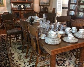Antique oak farmhouse table extends to comfortably seat 8. 