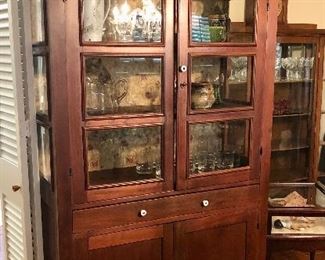 Antique Arts & Crafts cabinet. Framed glass, wide center drawer, 2 bottom cabinets.