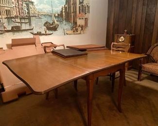 Danish style mid-century dining table. Four Chairs 
Drop leaf maple table with cover and 4 chairs American Chair Co