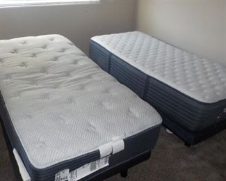 Electric Adjustable Beds (Remotes are present)  Note: These 2 NICE Single Beds available pre-sale for $150.00
