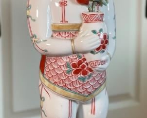 Chinese Porcelain Figurine Man with Flowers		
