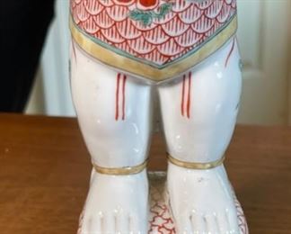 Chinese Porcelain Figurine Man with Flowers		
