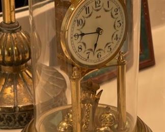 Antique Kundo Anniversary Clock	12 in high by 6.5 diameter	
