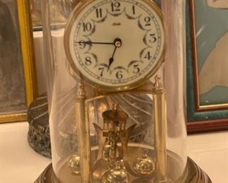 Antique Kundo Anniversary Clock	12 in high by 6.5 diameter	
