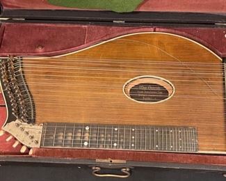 Antique Max Osterode Zither Stringed Instrument in case	3 x 26 x 15in	HxWxD
