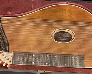 Antique Max Osterode Zither Stringed Instrument in case	3 x 26 x 15in	HxWxD
