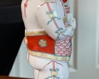 Chinese Porcelain Figurine Man with Flowers		
