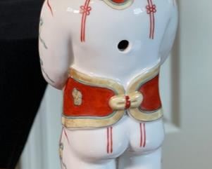 Chinese Porcelain Figurine Man with Flowers		
